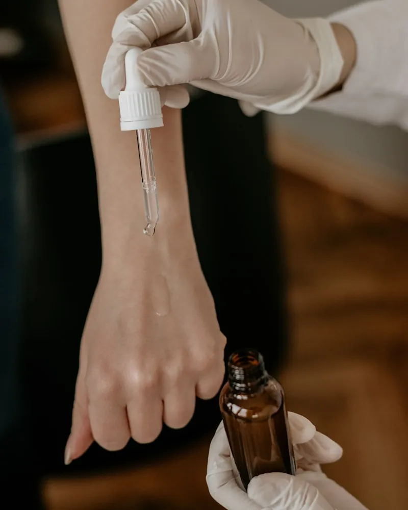 Serum dropper over a ceramic dish
